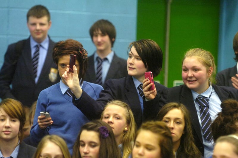 Players from Blackpool FC play a snooker match with Mark Selby and Shaun Murphy at Collegiate High School