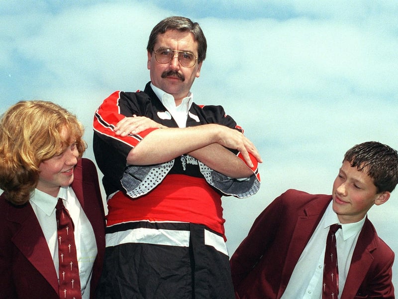 Montgomery head teacher Paul Moss prepares for his trip to Japan watched by pupils Elizabeth Barker and Matthew Swann, 1998