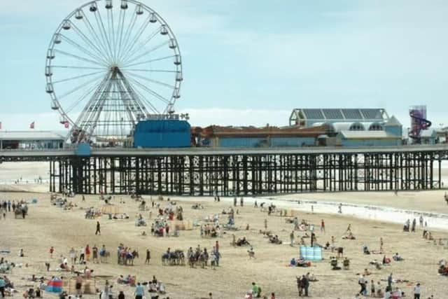 Blackpool beach on a sunny day is fun for all the family. Don't forget your bucket and spade!