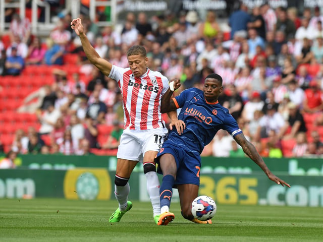 STOKE ON TRENT, ENGLAND - AUGUST 06: Dwight Gayle (L) of Stoke City is challenged by Marvin Ekpiteta of Blackpool during the Sky Bet Championship match between Stoke City and Blackpool at Bet365 Stadium on August 06, 2022 in Stoke on Trent, England. (Photo by Tony Marshall/Getty Images)