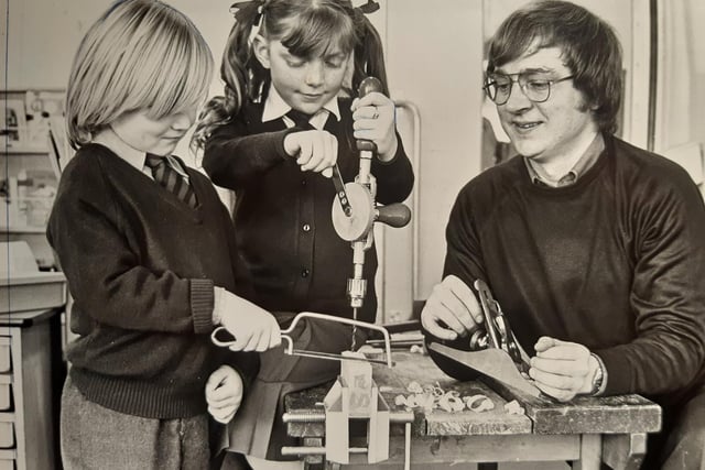 Tony Dickson, Raquel White and parents Barrie Bradley at a woodwork session at Moor Park Primary School in 1981