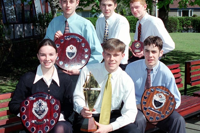 Directors of 'Equinox', The Lytham St. Annes High School enterprise team with their trophies, from left, Gayle Rice (Retail), Alex Feseto (Marketing),James North (Managing), Alan Watson (Finance), James Quine (Entertainments) and Joe Hirst (Operations) in 1998