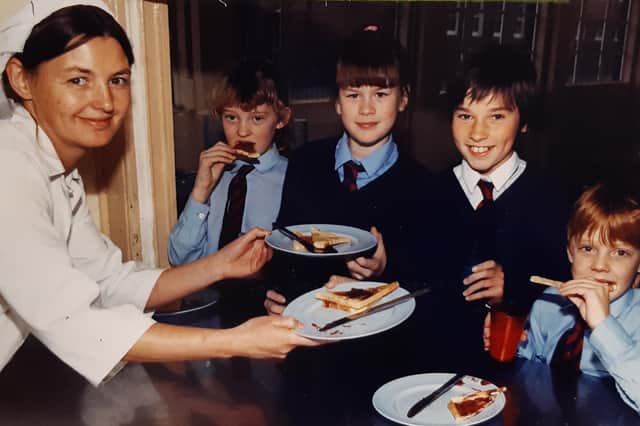 Karen Downes serves Francesca Buckley, Rachel O'Connor, Emma Davies and Michael Johnson at Devonshire Road School, 1990
