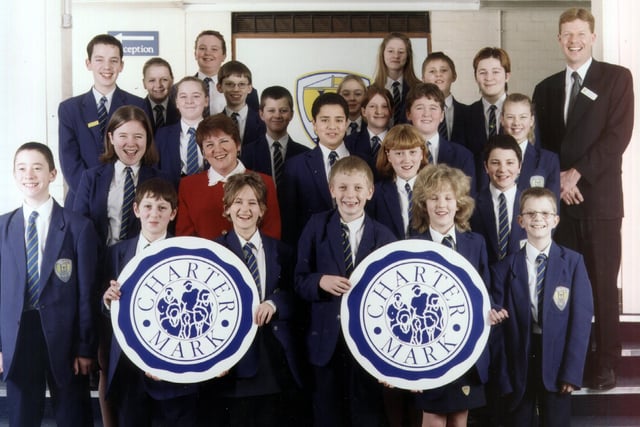Hodgson High School Headteacher Phil Wood and deputy head Susan Willoughby with pupils celebrating their new Charter Mark in 2000