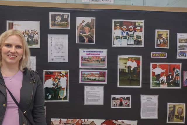 Former pupil Laura Bunting, now a teacher herself in Fleetwood, admires a display of pictures from the schools centenary 20 years ago.