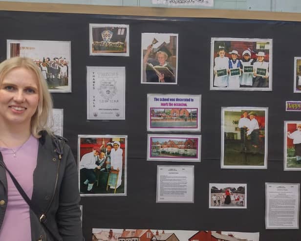 Former pupil Laura Bunting, now a teacher herself in Fleetwood, admires a display of pictures from the schools centenary 20 years ago.