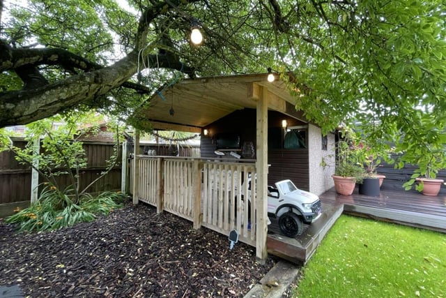 The garden benefits from a large garden room with an under cover sitting area