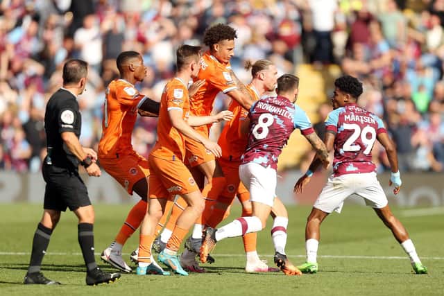 Burnley's Ian Maatsen gets involved in an altercation following an incident with Blackpool's Sonny Carey (not pictured). Both were subsequently shown a red card by referee Keith Stroud

The EFL Sky Bet Championship - Burnley v Blackpool - Saturday 20th August 2022 - Turf Moor - Burnley