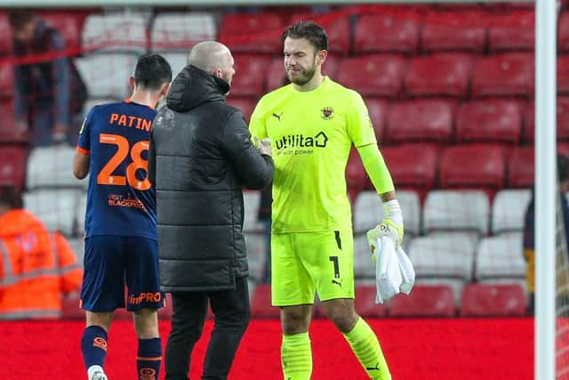 Michael Appleton shakes Chris Maxwell’s hand at full-time following the goalkeeper's late heroics