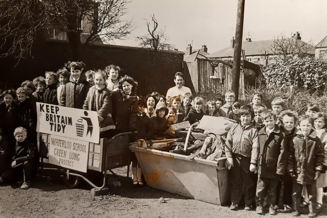 Waterloo Primary School pupils launch themselves into a clear-up to make a green play area in 1986