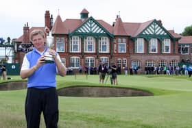 South Africa's Ernie Els lifts the Claret Jug and celebrates winning the 2012 Open Championship at Royal Lytham and St. Annes Golf Club.