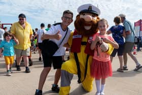 Ryan, aged 13, and Lily Wright, five,  with RNLI mascot Stormy Stan at Lytham St Annes RNLI open day. Photo: Kelvin Lister-Stuttard