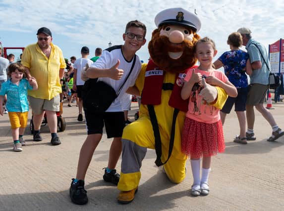 Ryan, aged 13, and Lily Wright, five, with RNLI mascot Stormy Stan at Lytham St Annes RNLI open day. Photo: Kelvin Lister-Stuttard