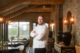 Chef patron Sean Wrest pictured in the conservatory dining area at Ye Horns Inn