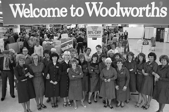 Staff gather one last time outside the famous Woolworth's shop, in the shadow of Blackpool Tower, as it prepares to close its doors to the public forever