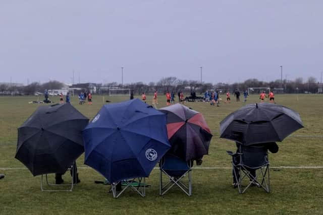 The Umbrella brigade. Photo: Johnathon Bailey