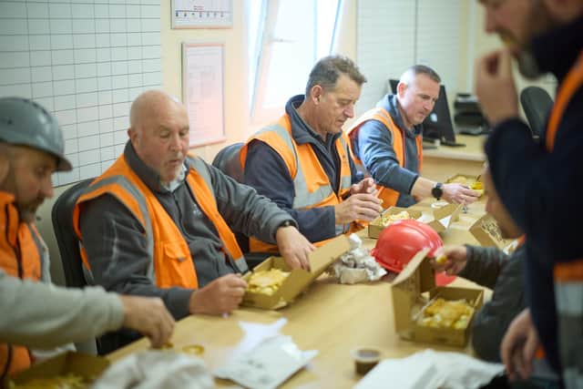 BM - MWjun25-898891 - The Site Team at Rogerson Gardens eating their Fish and Chips