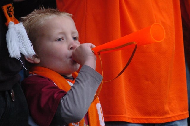 Making lots of noise - this little one gets into the spirit of the game against Oldham in 2007