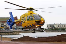 The air ambulance landed near to a housing estate.