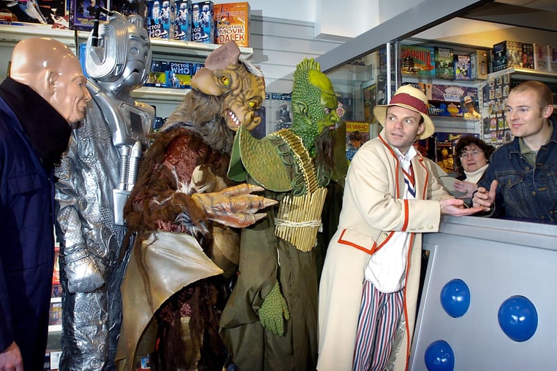 Can Cybermen get in for half price? Doctor Who and a few friends queue for the exhibition in 2004