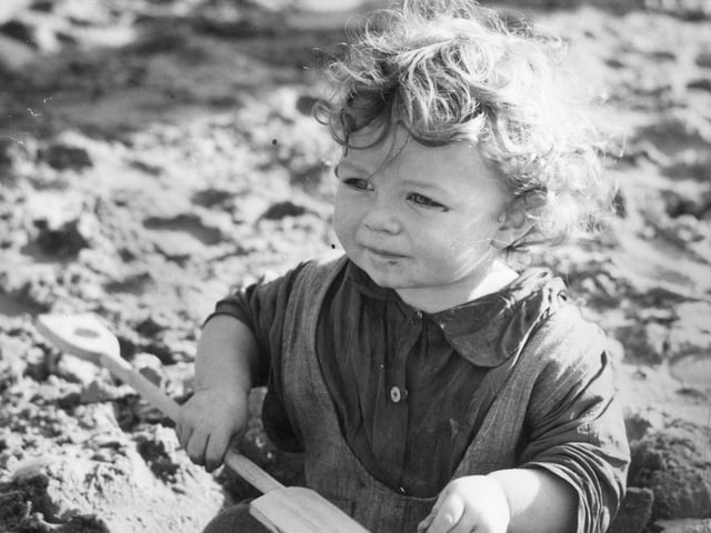 Such an emotive picture showing a little evacuee from the East End of London playing on the sands in 1940