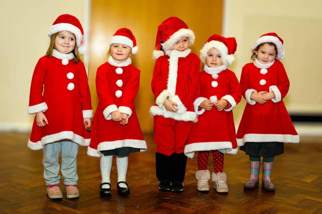 The mini-buddies from the nursery get into the festive spirit during the Christmas lunch at Manor Beach Primary School in Cleveleys