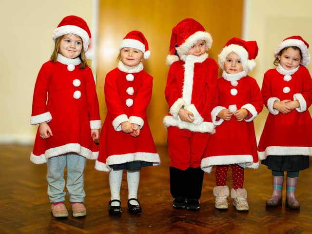 The mini-buddies from the nursery get into the festive spirit during the Christmas lunch at Manor Beach Primary School in Cleveleys