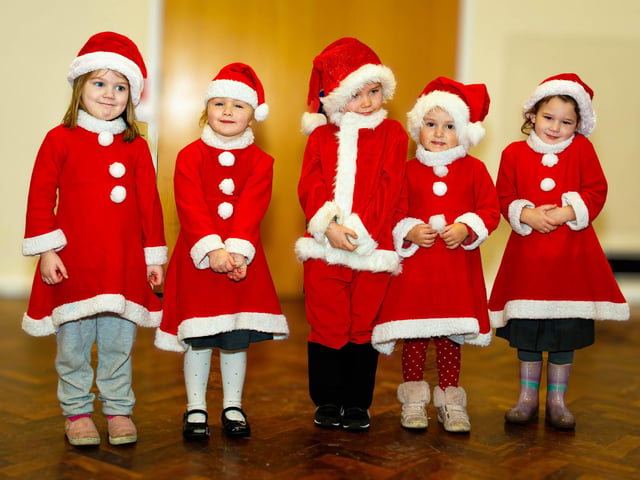 The mini-buddies from the nursery get into the festive spirit during the Christmas lunch at Manor Beach Primary School in Cleveleys