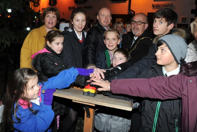 Local dignitaries and pupils from schools in the area press the button to switch on the tree lights at the Garstang Christmas lights switch-on event in 2014
