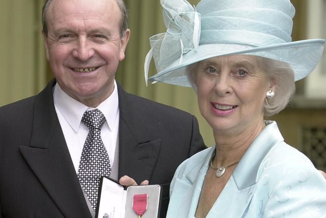 Former Blackpool and England full-back Jimmy Armfield alongside his wife Anne at Buckingham Palace after he recieved his OBE from the Prince of Wales