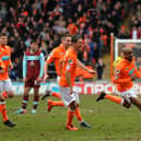 Ludovic Sylvestre gives his team-mates the slip as he celebrates after his goal