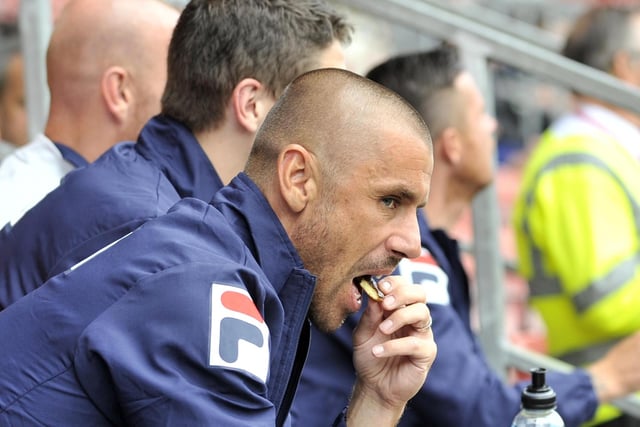 Blackpool's Kevin Phillips enjoys a snack in the stands at the pre-season friendly against Wrexham