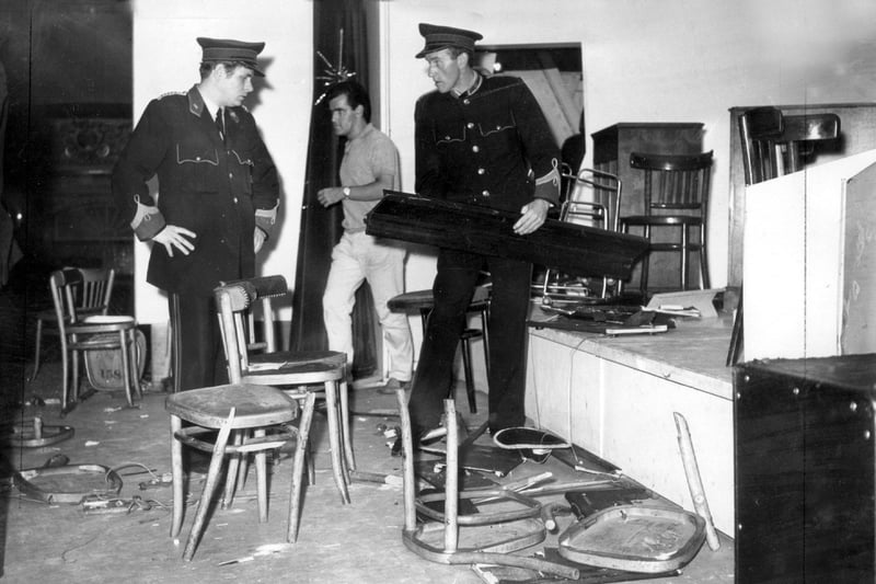 Winter Gardens staff clear up the aftermath of the Rolling Stones riot. A grand piano was reduced to matchwood