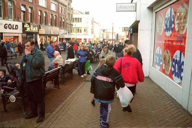 A crowded shopping street in Blackpool, 1996. Some of those names have disappeared from the high street - Tie Rack, Allsports...