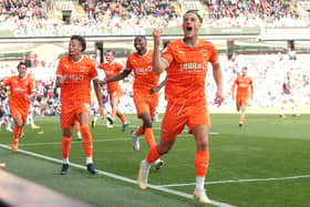 Jerry Yates scored his first goal of the season to earn Blackpool a point at Turf Moor