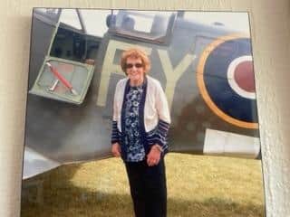 Mary Stuttard with a Spitfire plane at the Blackpool visitor centre