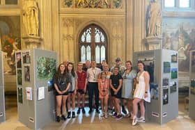 Members of Blackpool Boys and Girls Club with MP Scott Benton and their photographic exhibition at the Houses of Parliament