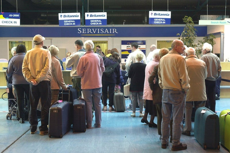 Passengers waiting to check in for flights to Spain and the Canary Islands