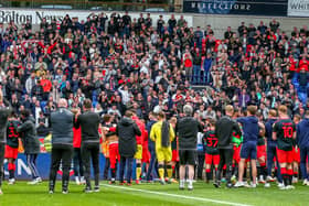 Fleetwood celebrate their League One survival with supporters at Bolton but it was a close run thing Picture: SAM FIELDING / PRiME MEDIA IMAGES