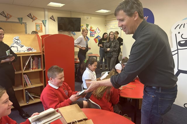 Jeff Kinney with pupils from Our Lady of the Assumption Catholic Primary School.