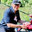 Volunteer caster Allan Brown with Great Arley School pupil Phoenix Slater who caught his first fish