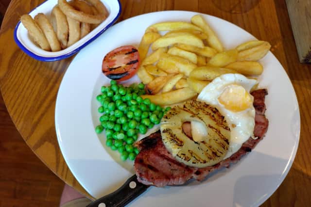 Gammon steak came with pineapple, fried egg, chips, peas and tomato at the Three Lights in Fleetwood