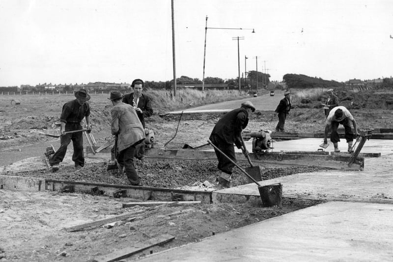 Workmen taking the new runway at Blackpool Airport across Leach Lane in August, 1953