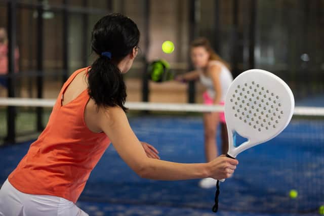 Padel, a cross between tennis and squash, is rapidly growing in popularity (generic photo: Adobe Stock)