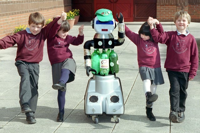 Cycler the recycling robot learns to walk with some of the children at Marton Primary School. Pictured are (from left), Matthew Rowley, Abergale Britton , Olivia Freitas-Jones and Ryan Calvert