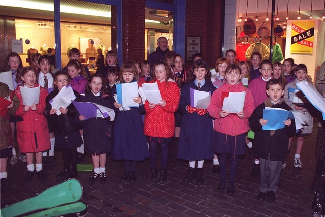 Pupils from Anchorsholme C.P. School gave a carol concert at Hounds Hill shopping centre with all donations towards the Gazette and Radio Wave United For Christmas Appeal in 1996
