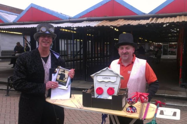 Street performers Bob Adams and Jamie Rosser with their magic act in Doncaster town centre.
