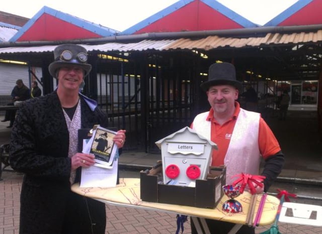 Street performers Bob Adams and Jamie Rosser with their magic act in Doncaster town centre.