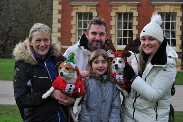 BLACKPOOL - 04-12-22 Dogs and their owners take part in Walkies for Wards, a festive dog walk raising funds for Blue Skies Hospital Funds, a charity for Blackpool Teaching Hospitals, held in the grounds of Lytham Hall, Lytham. from left, Susan, Dexter the dog, Tim, Maxi, ten, Barney the dog and Ashley.
