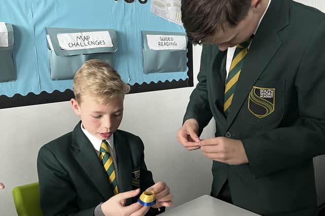 Josh Holden and Luke Harrison made ribbons in the colours of the Ukrainian flag to sell